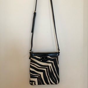 Kate Spade zebra print crossbody purse.